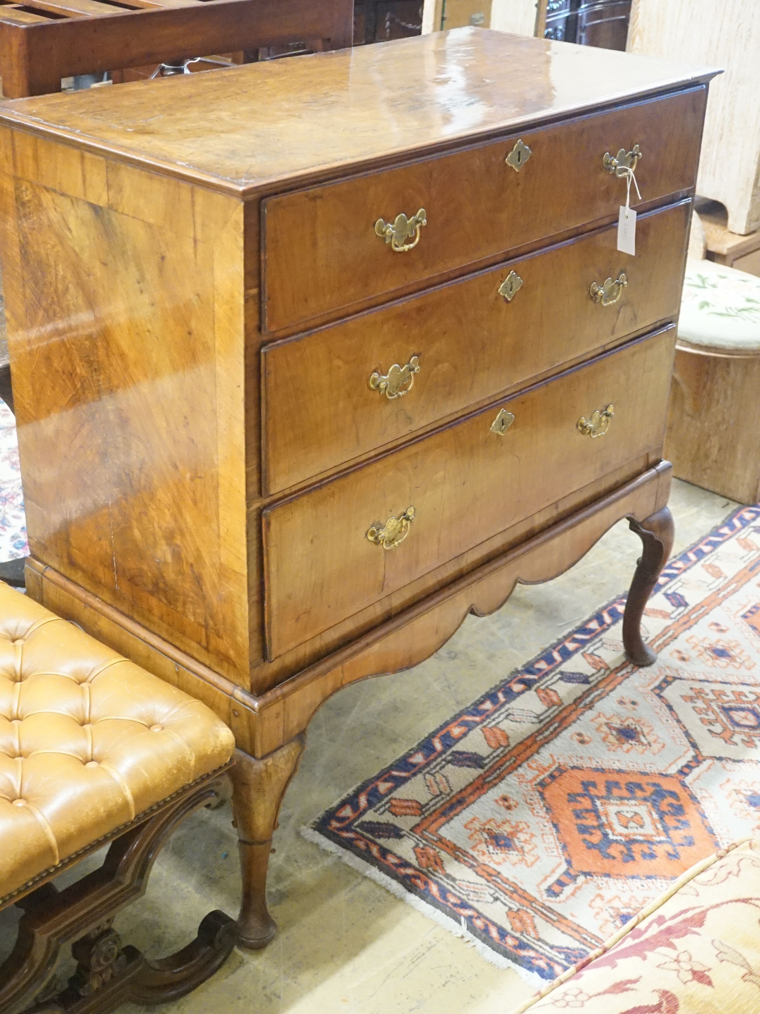 An 18th century walnut chest on later stand, width 104cm depth 52cm height 110cm